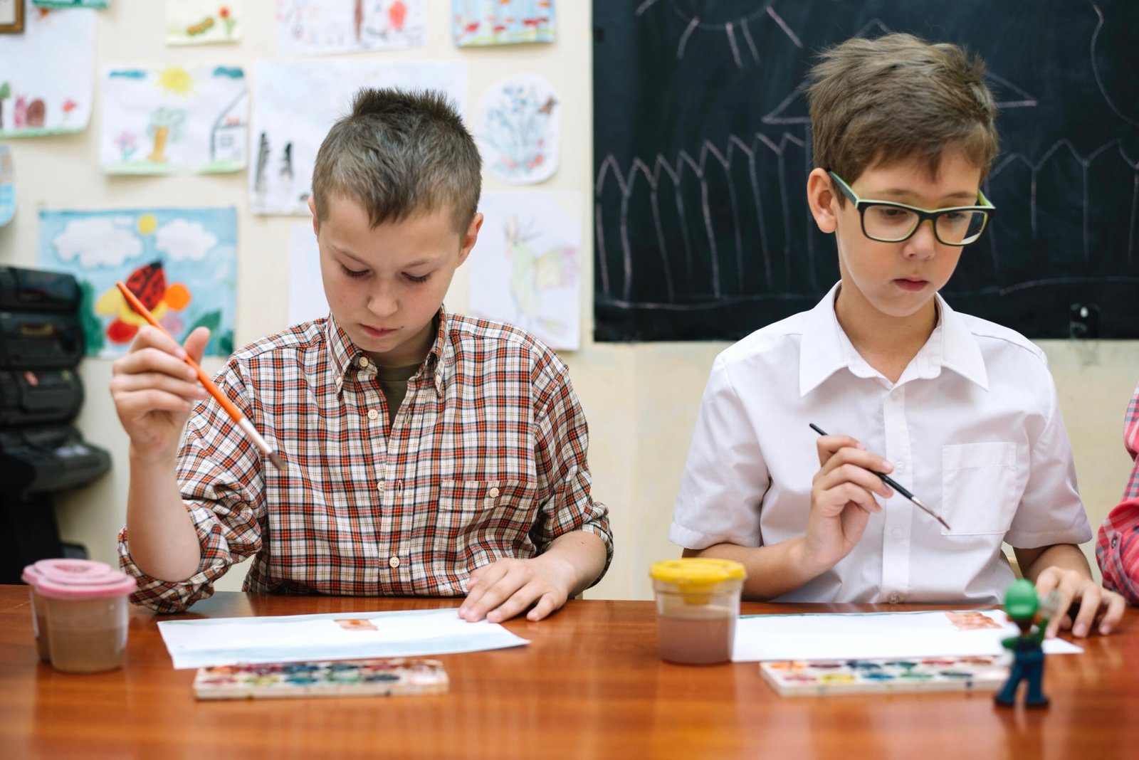 Students drawing together in a classroom